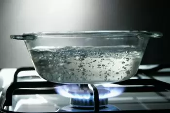At what temperature does the water boil?